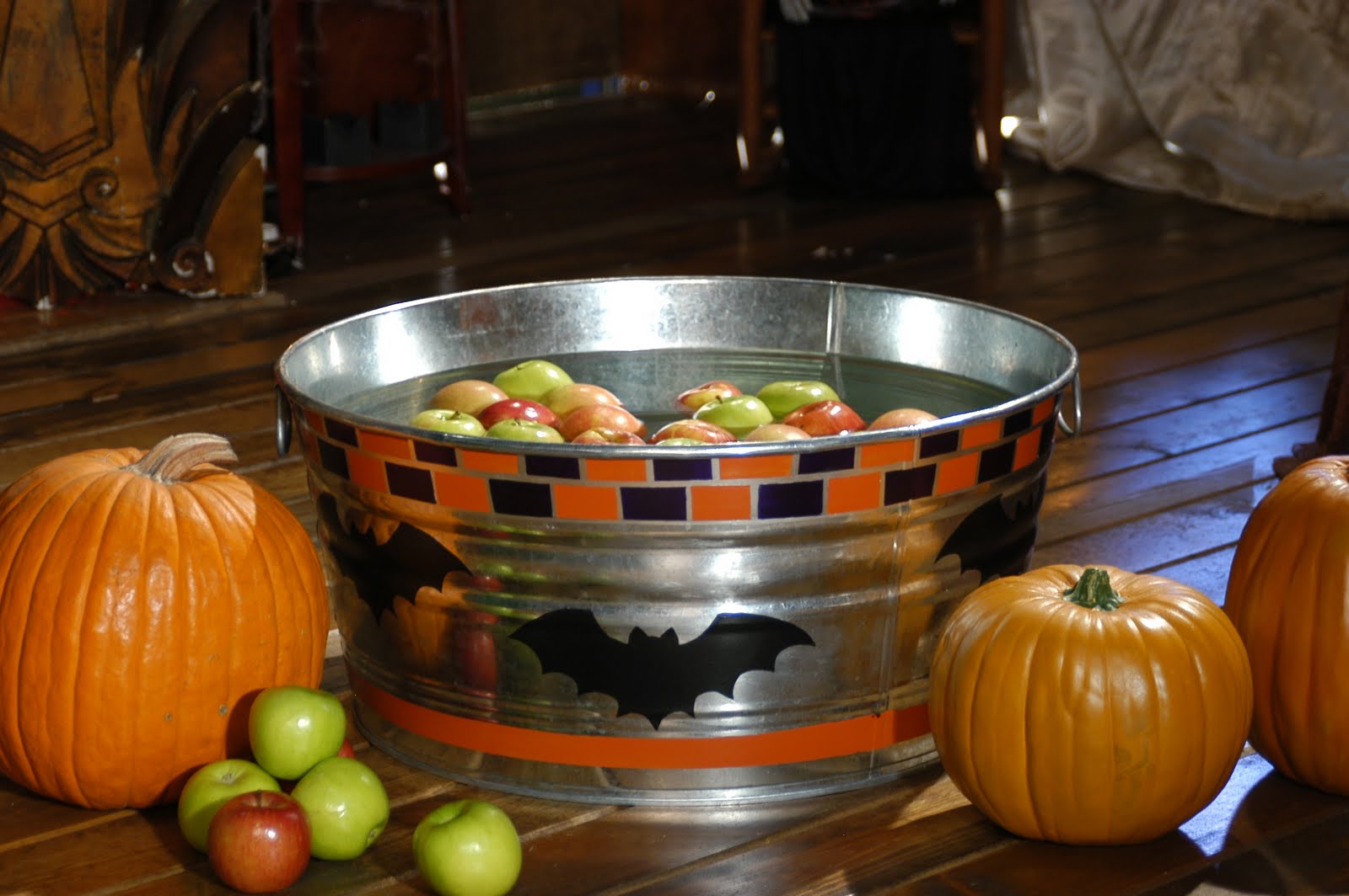 Bill Jackson http://handmadehappyhour.com/2010/10/13/halloween-witch-crafts-apple-bobbing-tub/